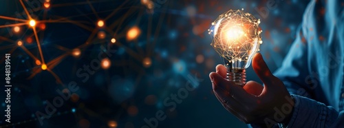 A businessman holding a creative light bulb is shown on a blue city background with a digital networking and Project Management icon. He is holding a project planning, resource allocation, and