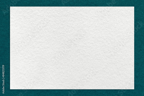Texture of craft white color paper background with emerald border, macro. Vintage dense kraft teal cardboard