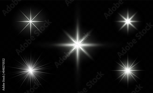 A realistic vector illustration of various light effects on a black background, including sparkling stars and flickering and flashing lights.Collection of different light effects on black background