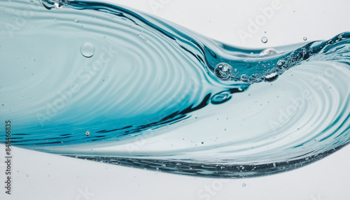 Macro close-up of water wave and air bubbles inside clear blue liquid on white background
