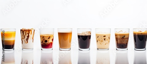 Glass coffee cups in various designs displayed on a white backdrop ideal for copy space image