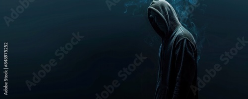 Mysterious figure wearing a dark hoodie, face hidden in shadows, evoking a sense of intrigue and anonymity.