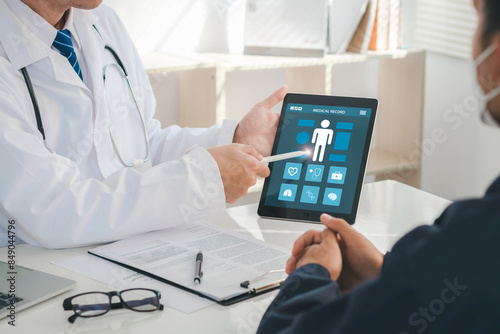 Medicine, healthcare and people concept. A doctor is showing a patient's medical record on a digital tablet. The patient is looking at the screen and listening to the doctor. Results for health.