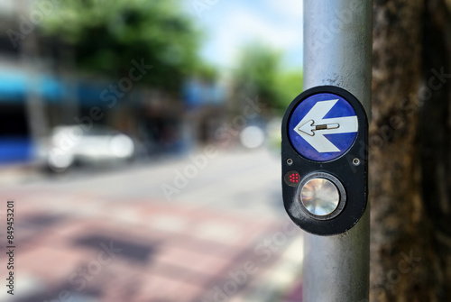Pedestrian Traffic Crosswalk Button with Blurred Background.