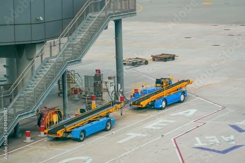 Equipment of a machine for loading and unloading luggage on an airplane. Serviced in preparation for boarding