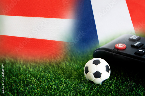 football match , Austria vs France , Football Nation Flag and soccer ball on green grass