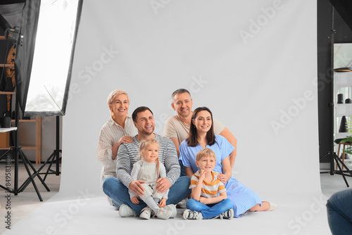 Big family having photo shoot in studio