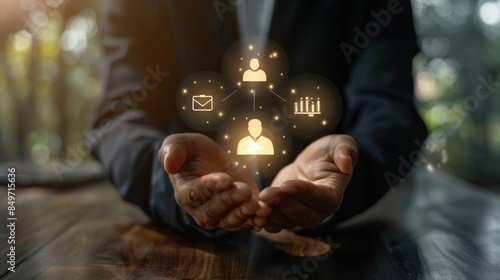 Values icons grasped by a businessman representing ethics and empathy. Businessman hand holding Value business (goals icons) . on table background. Mission, Vision