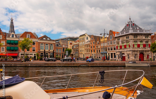 Overcast cityscape of Haarlem, North Holland, Netherlands. View of Spaarne River embankment.