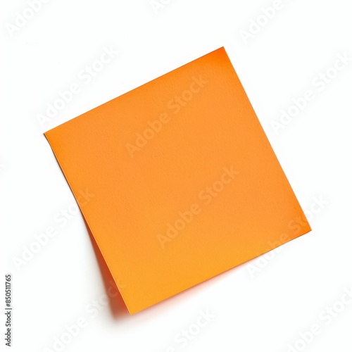 A single bright orange sticky note placed askew on a white background.