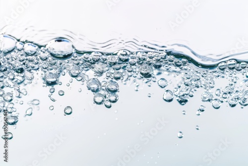 A dynamic, close-up image of a column of air bubbles rising in crystal clear water, capturing the essence of motion and fluidity