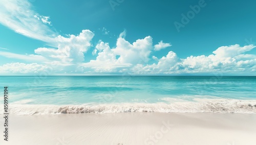 A peaceful beach scene with pristine white sand, gently lapping turquoise waters, and a vibrant blue sky adorned with fluffy white clouds. 