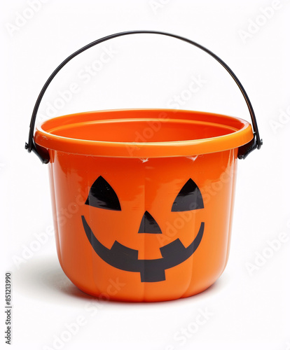 Jack o lantern candy bucket isolated on white background, used for trick or treating on Halloween