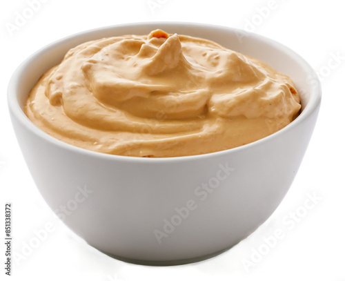 Isolated on a white background, this white bowl features a chipotle aioli created with mayonnaise, chipotle peppers in adobo sauce, garlic, and lime juice. The side and top views are transparent and t