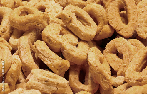 Background of many TARALLIN, the typical baked product from southern Italy in a ring shape