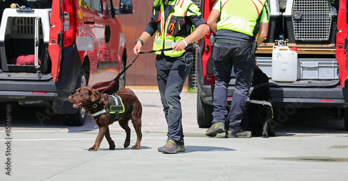 Two dog handlers Two dog handlers with the K-9 unit during the drill with exceptional sense of smell dog