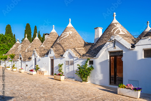 Famous historical old dry stone trulli houses with conical roofs in Alberobello, Italy.