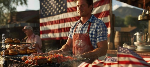 Man Cooking Hamburgers on Grill in Front of Large American Flag