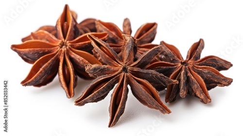 Star anise or bunga lawang on a plain white backdrop