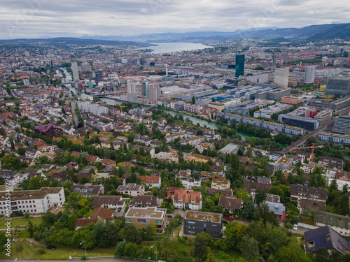 Zurich Switzerland residential area by the river Limmat with industrial area on the other riverside towards the lake, aerial view, drone shot