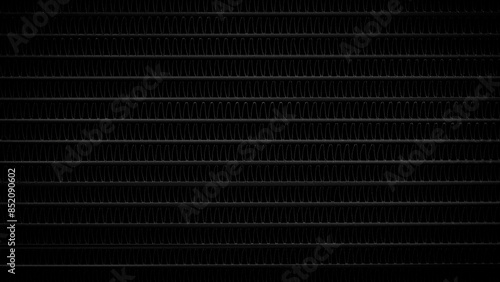 A black and white backgroundof a metal surface with a lot of lines