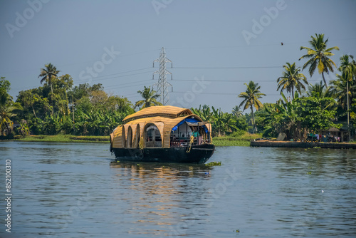 Kerala tourism - Houseboat in Kerala backwater sailing through the canals in Alleppey