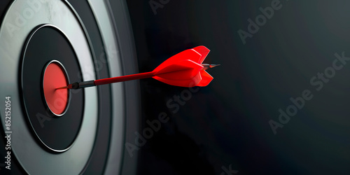 Close-up of a red dart in the middle of a target in target shooting. Achieve goals