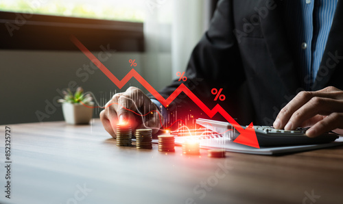 Economic collapse concept, businessman with falling financial graph chart due to global recession. Stock market crash, inflation, financial crisis, Falling income in GDP, capital reduction