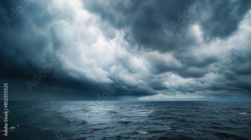 Dark clouds looming above the ocean Wintry sky landscape