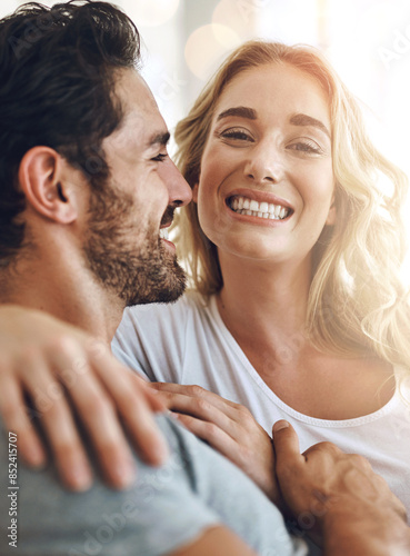 Happy, relax and portrait of couple in home with hug, love and care for bonding together. Smile, marriage and young woman and man embracing for commitment, support and connection at house in Canada.