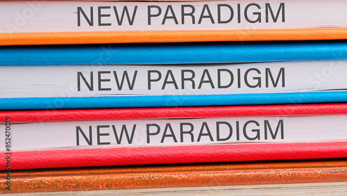 New paradigm motivational phrase close-up on the ends of the notebooks