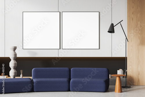 Modern living room interior with blank poster mockups on wall, minimalist furniture, contemporary decor concept. 3D Rendering