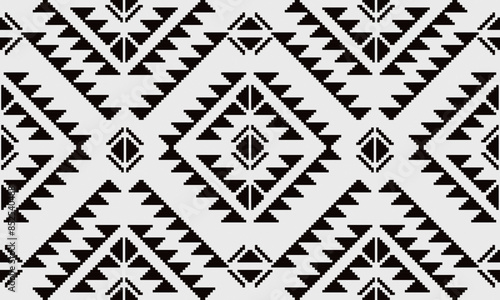 a fabric pattern composed of pixelated and white background designs