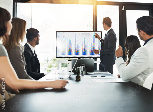 Businessman, meeting and communication with data on screen for sale metrics review, insights and planning. Talking, people and finance or trading analytics for asset performance and profit management