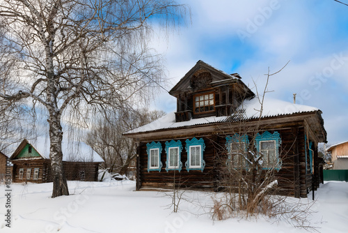 Wooden village houses on a cold winter day