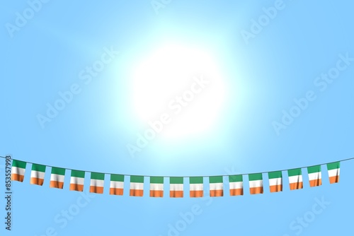 nice independence day flag 3d illustration. - many Ireland flags or banners hangs on string on blue sky background