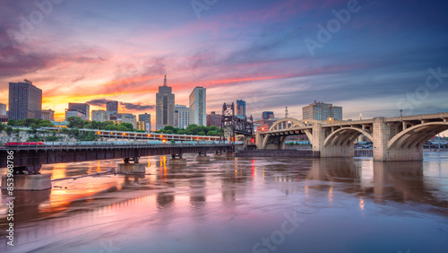 Saint Paul, Minnesota, USA. Cityscape image of downtown St. Paul, Minnesota, USA with reflection of the skyline in Mississippi River at beautiful summer sunset.