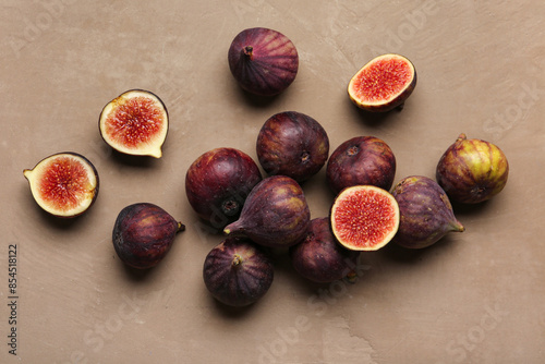 Fresh ripe figs on brown background