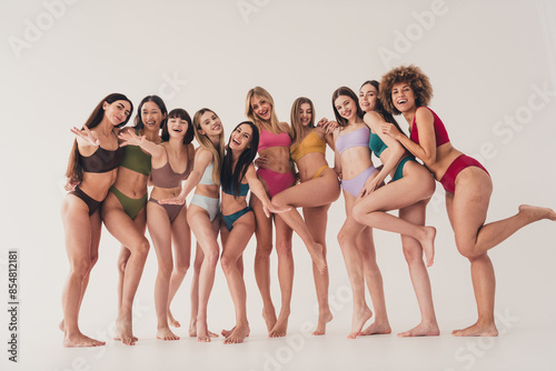 Full length photo of ten lovely models advertising high quality set underwear isolated on white color background