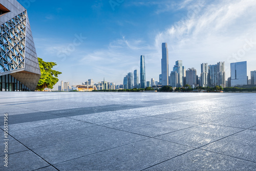 Empty square floor with modern city buildings scenery in Guangzhou. Road and buildings background.
