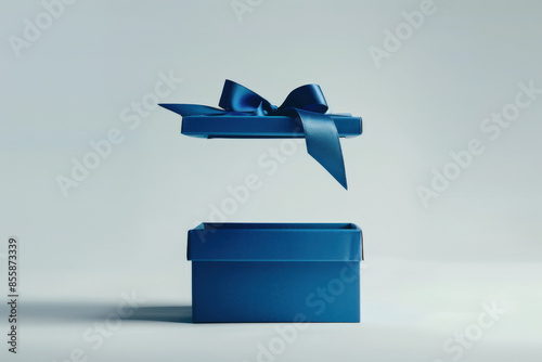 Elegant blue gift box with its lid floating above, revealing the empty space inside