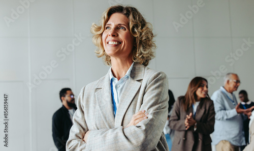 Confident mature businesswoman smiling during a business meeting