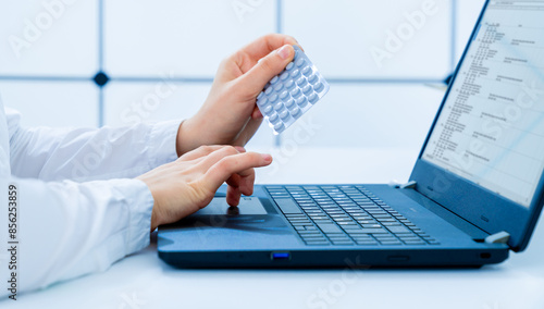 young woman doctor examines the compatibility of a medication with other medicinal substances