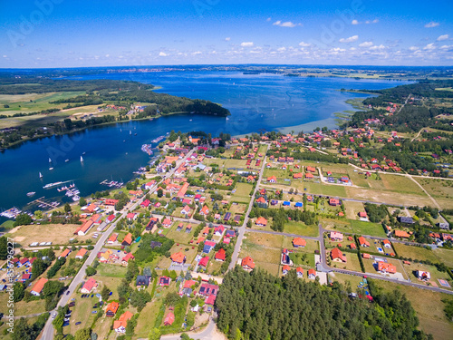 Aerial view of Rydzewo village on the shore of Boczne Lake, Masuria, Poland