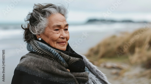 Elderly Maori Woman Enjoying a Beach Walk in Winter