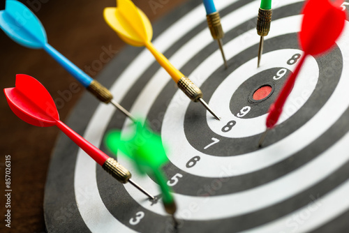 Many darts on the dartboard but not a single one hit on the center of the target, inaccurate arrow, missed the main point, or set goal, and chance concept