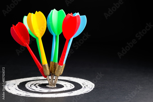 All the colorful darts hit on the center of the target, all for one purpose, set only one goal, business and marketing competition concept