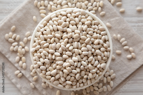 Organic White Beans in a Bowl, top view. Flat lay, overhead, from above.