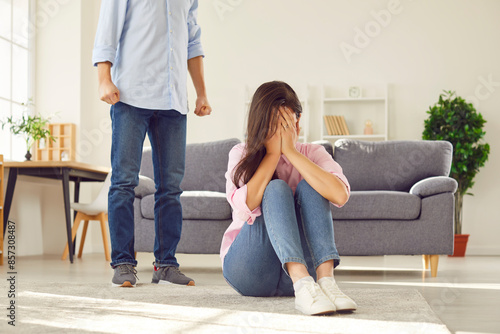 Couple family abuse, cruel, violent or indecent home treatment, insulting and offensive man. Young woman in emotional or psychological abuse floor sitting crying face closing, hiding from violation