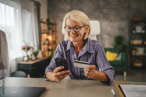 Mature woman work from home buy online on cellphone use credit card
